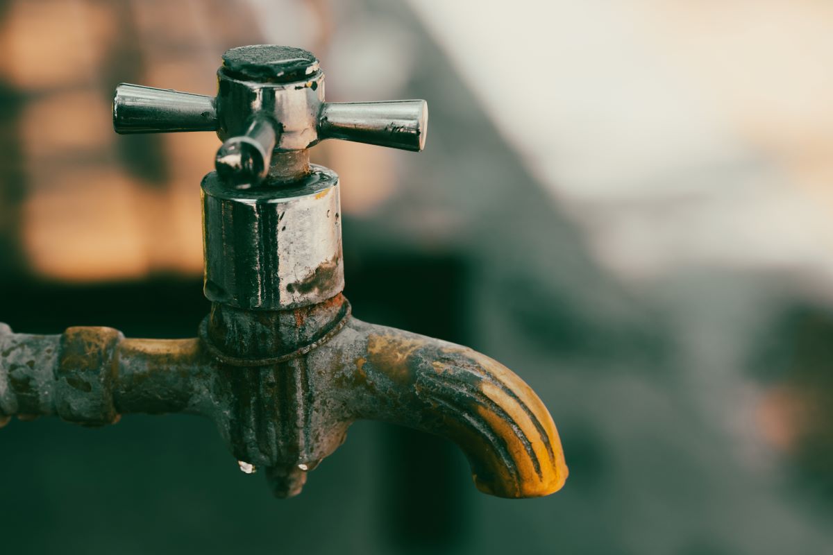 A Rusty Metal Faucet in Close-up Photography