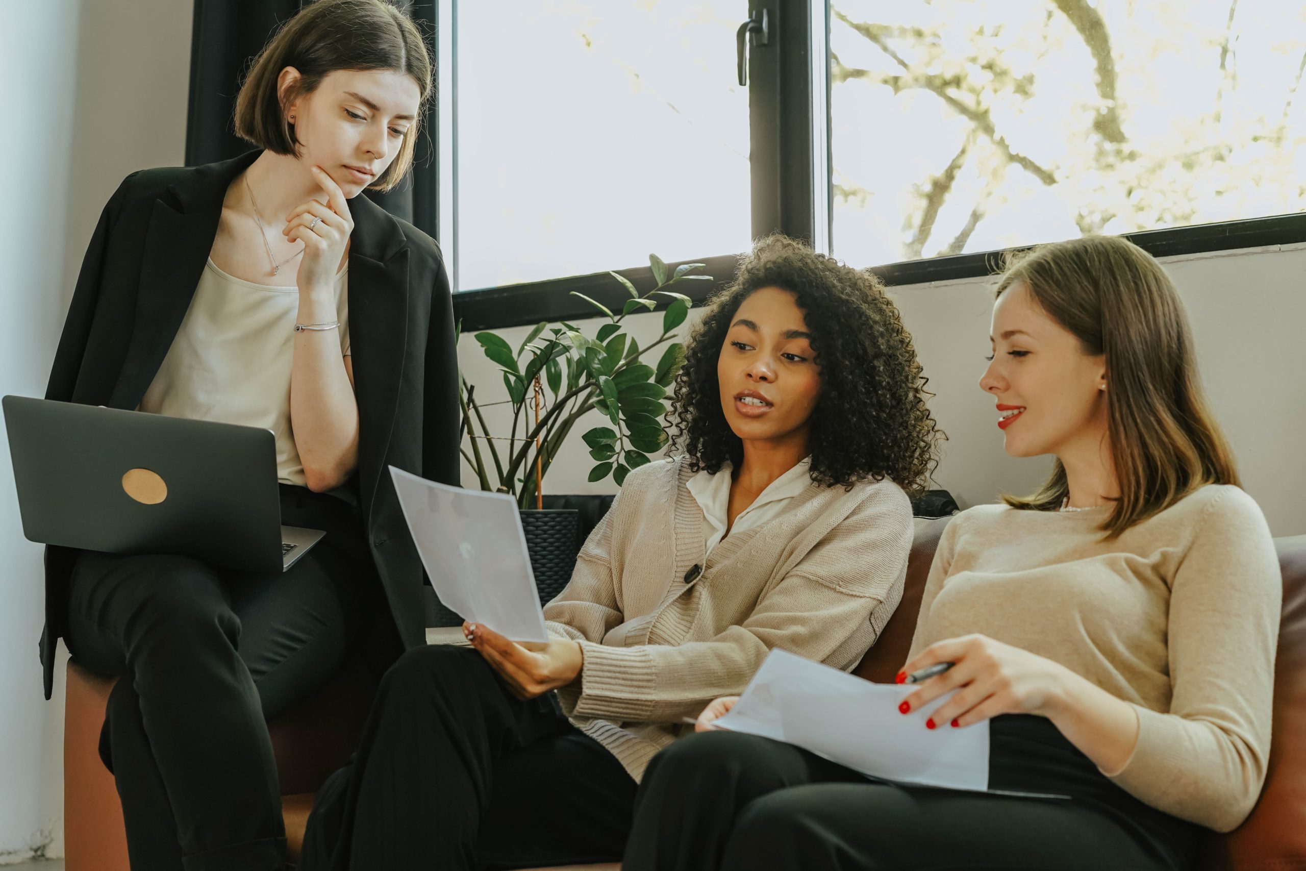 Women looking at grant guidelines